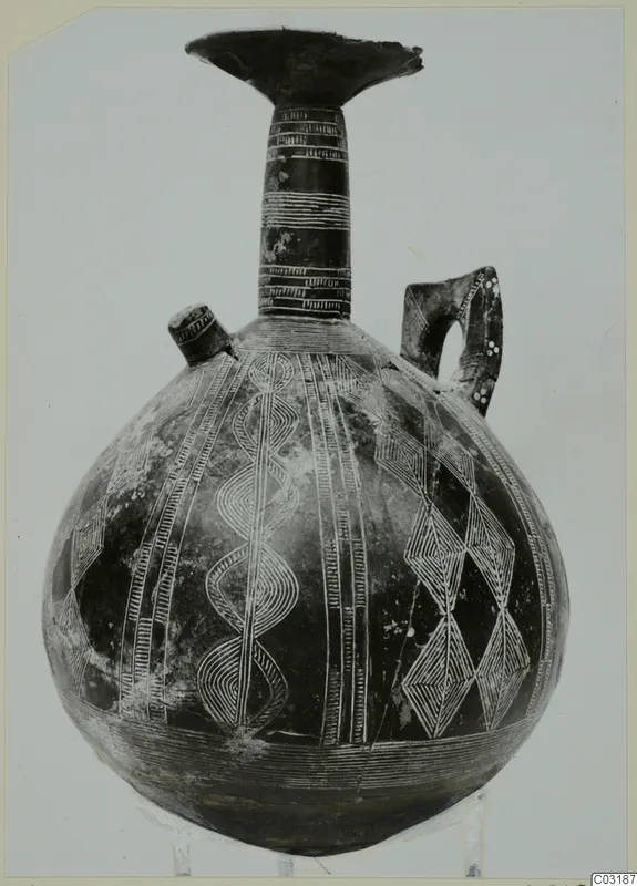 Pottery Red Polished II jug with incised bands and lozenge patterns, from Lapithos.