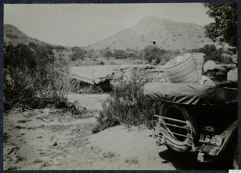 Gudrun Birgitta Atterman in a car beside the Limnitis bridge at Vouni, with hills behind.