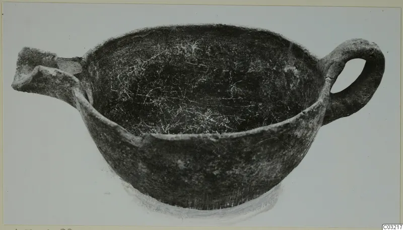 Pottery Red Polished III bowl with a loop handle on the right and a broken spout or lug on the left