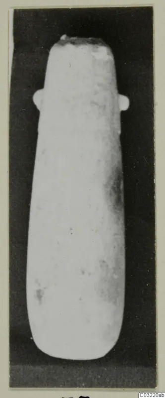 Alabaster vase with two small lug handles near the rim, photographed against a dark background