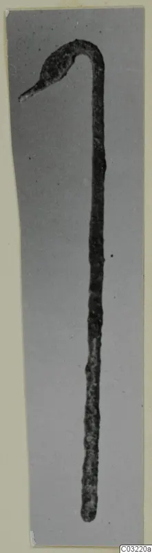 Bronze ladle with a long thin handle curving up to a small hooked bowl end