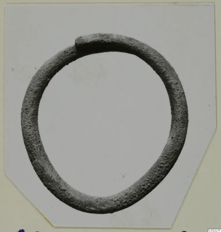 Closed metal ring of round section, one end overlapping the other, from Ayios Iakovos