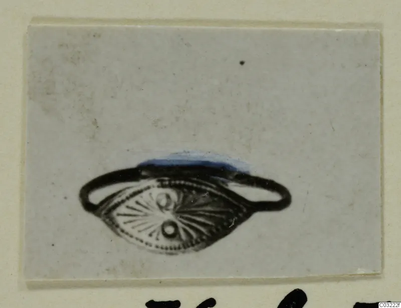 Finger ring with an oval bezel decorated with radiating lines and dots, from Marion