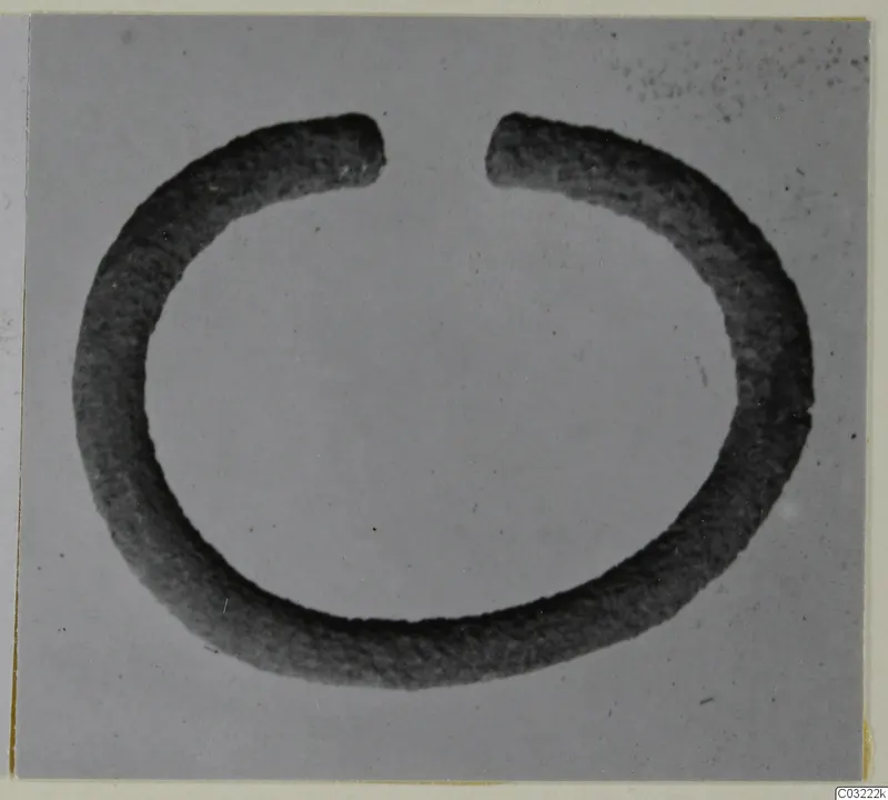 Open silver ring, a thick penannular band with its two ends apart at the top