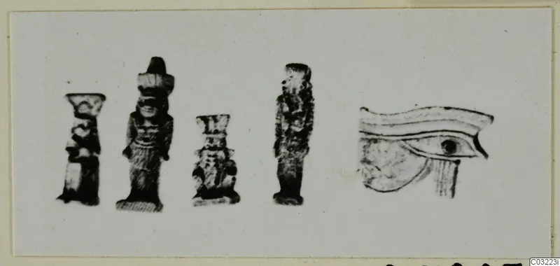 Four small figurines and an eye motif from Marion, shown together on a light background.
