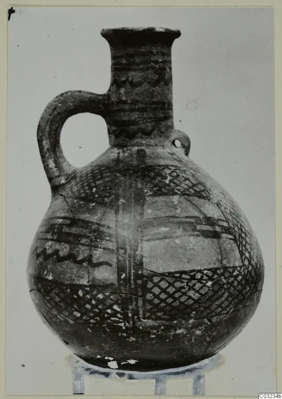 Pottery jug with a strap handle and dark painted bands, a find from the Vrysi tou Barba tombs at Lapithos