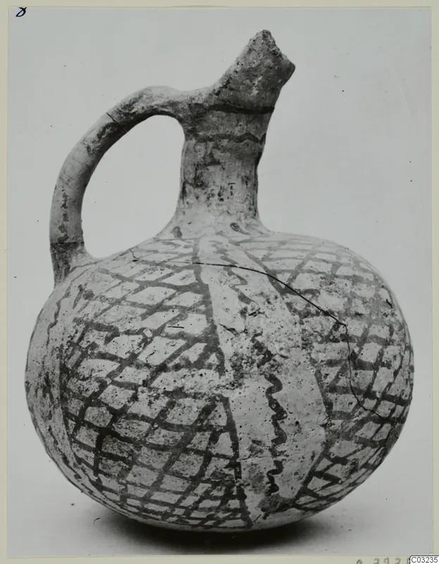 Pottery jug, White Painted III-2, from Lapithos, its round body covered with a dark lattice pattern
