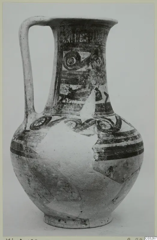 Pottery Bichrome Wheel-made jug from Milia with a loop handle and dark painted bands and circles