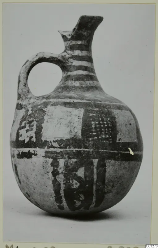 Pottery White Painted jug from Milia with dark painted bands and panels on a pale body