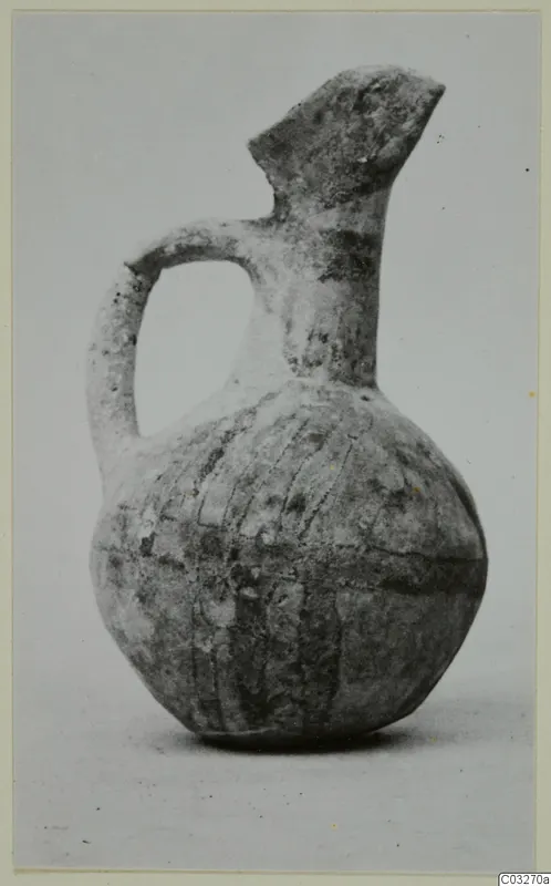 White Painted juglet from Milia with a single handle, flared spout and painted bands on the body
