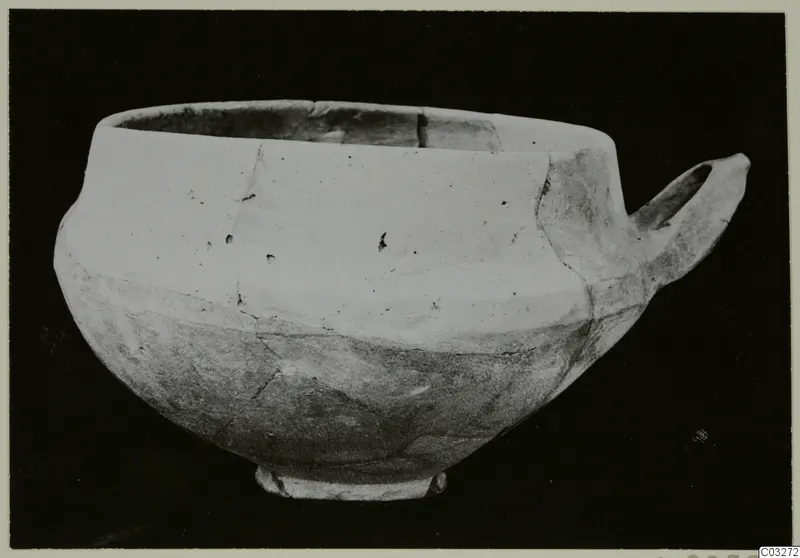 Base-Ring Ware pottery bowl with a single horizontal handle on its right side, from Milia