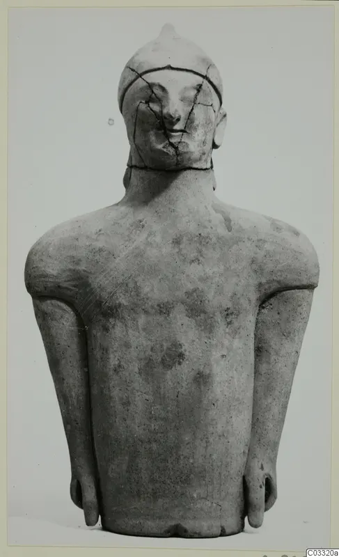 Terracotta figure of a standing figure with arms at its sides and a cracked head, seen from the front