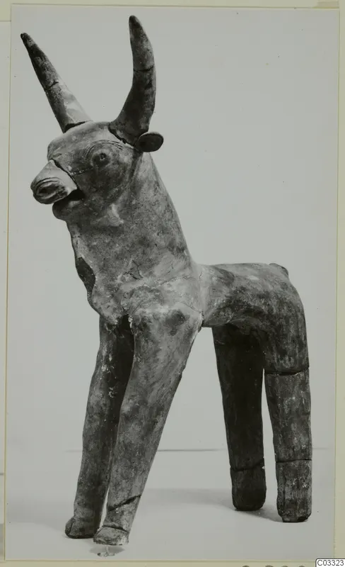 Terracotta figurine of a horned animal standing on four legs, from the Terracotta Minor Plastic series.