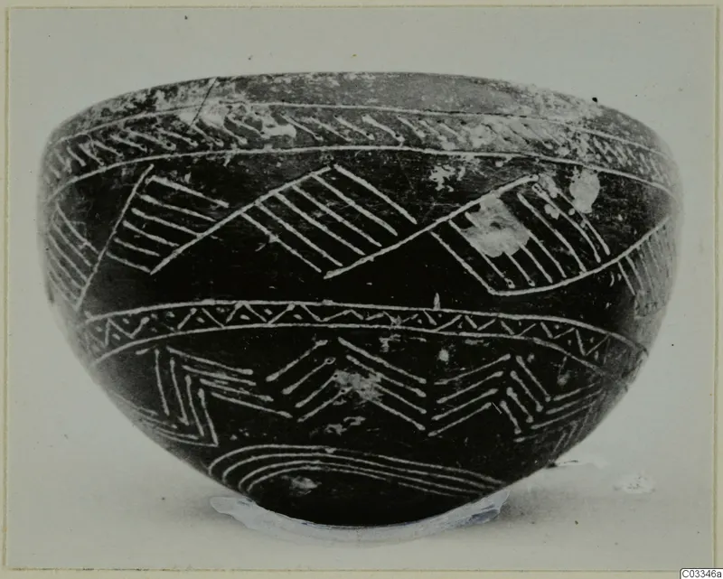 Red Polished II bowl from Lapithos with white linear decoration on a dark surface