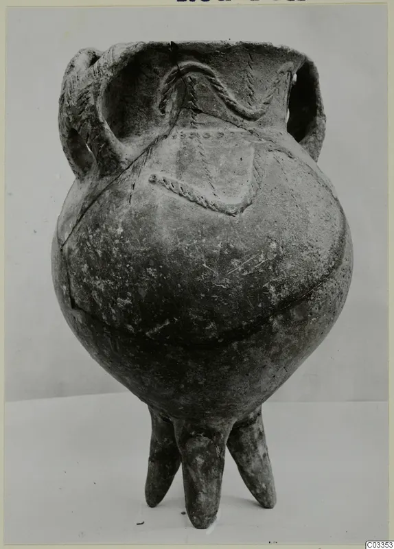 Pottery Red Polished III amphora with two handles and three feet, from the Vrysi tou Barba tombs at Lapithos