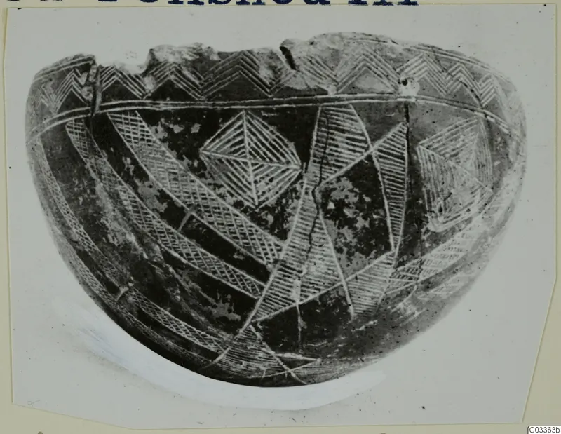 Pottery Red Polished III Bowl with incised hatched triangles, zigzags and bands, shown on a card mount
