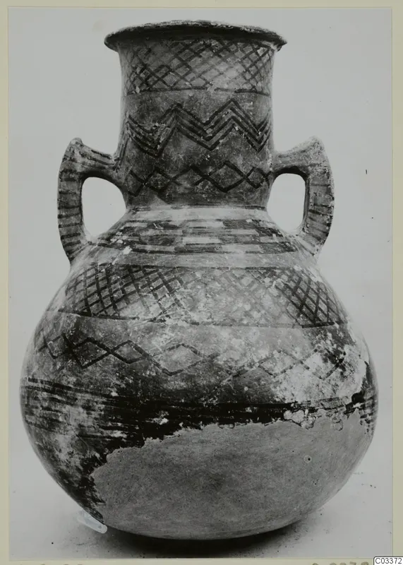 Two-handled White Painted pottery jar with black painted geometric bands, from Lapithos