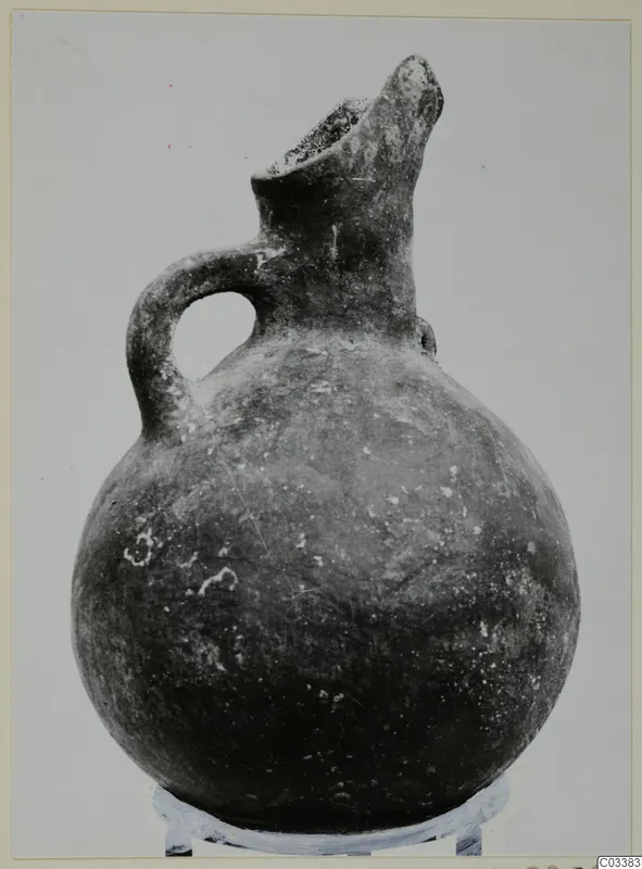 Red Polished III jug from Lapithos, Vrysi tou Barba tombs, with a beaked spout and single loop handle