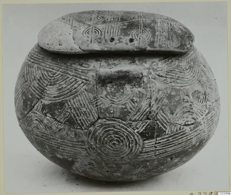 Pottery Red Polished III amphora from Lapithos, with incised concentric circles and curved lines on body and flat top