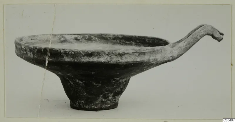 Base-Ring Ware bowl from Enkomi with a long curved handle ending in a rounded knob