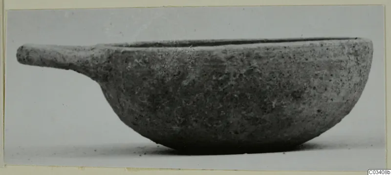 Pottery Plain White Wheel-made bowl with a short handle, seen from the side