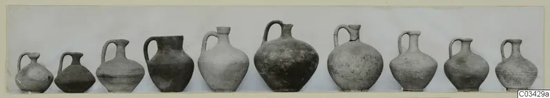 Row of ten jugs and juglets from Kountoura Trachonia, shown side by side.