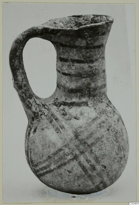 White Painted IV-V jug from Enkomi with a strap handle, bands on the neck and crossed diagonal lines on the body