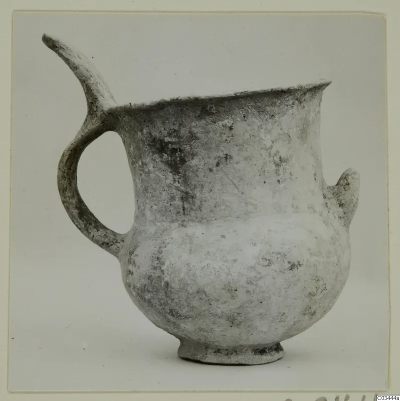 Pottery White Slip Ware vessel with a spout, a loop handle and a small lug, from Enkomi