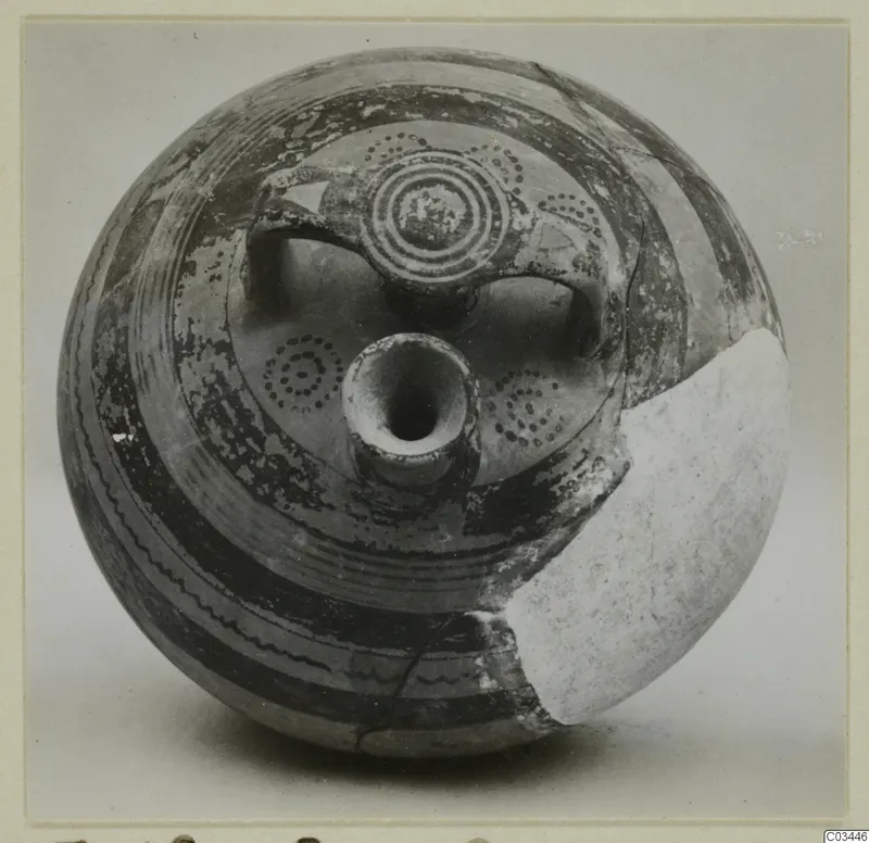 Levanto-Helladic Ware bowl-jar with painted concentric circles and bands, a central spout and a broken section on the right