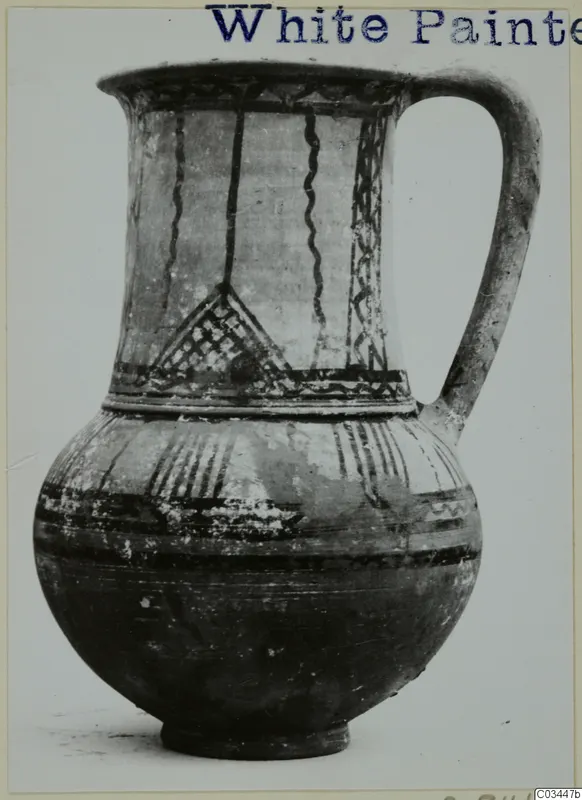 Pottery jug with a single handle and dark painted bands, wavy lines and lattice motifs, from Enkomi