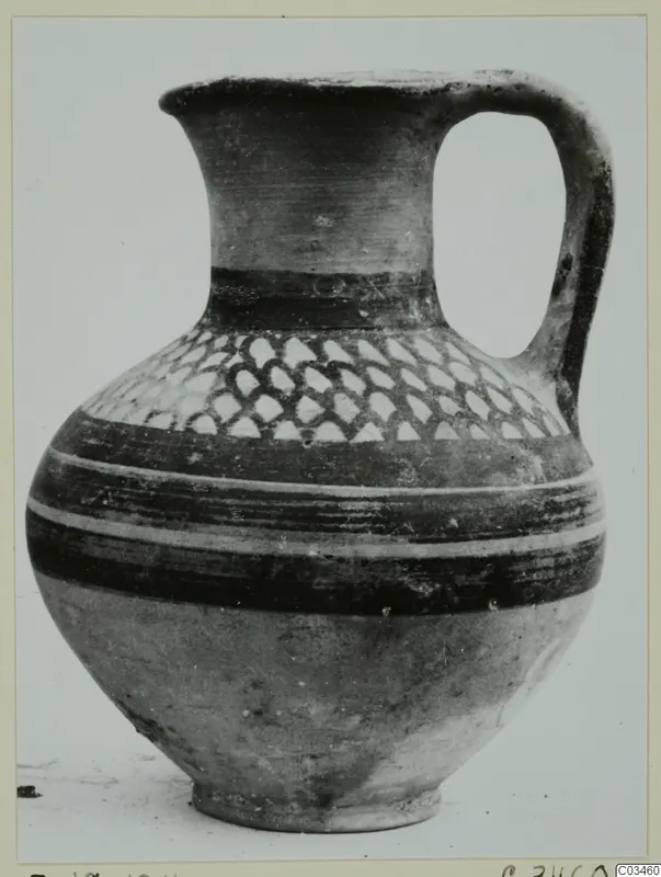 Painted single-handled vessel from Enkomi, shown on a plain background.