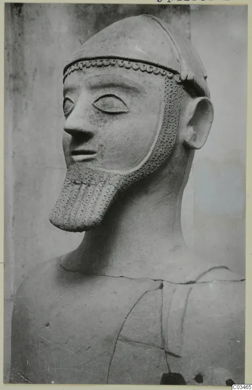 Terracotta bust of a bearded male figure wearing a close-fitting cap, three-quarter view