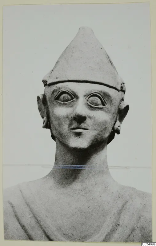 Terracotta head and shoulders with a tall conical cap and large almond-shaped eyes, seen from the front