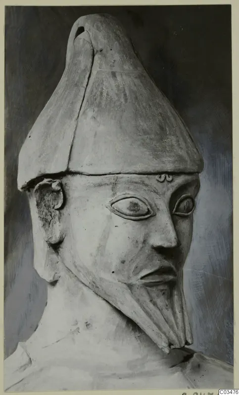Terracotta Proto-Cypriote I, head and upper body of a bearded figure in a tall pointed headdress
