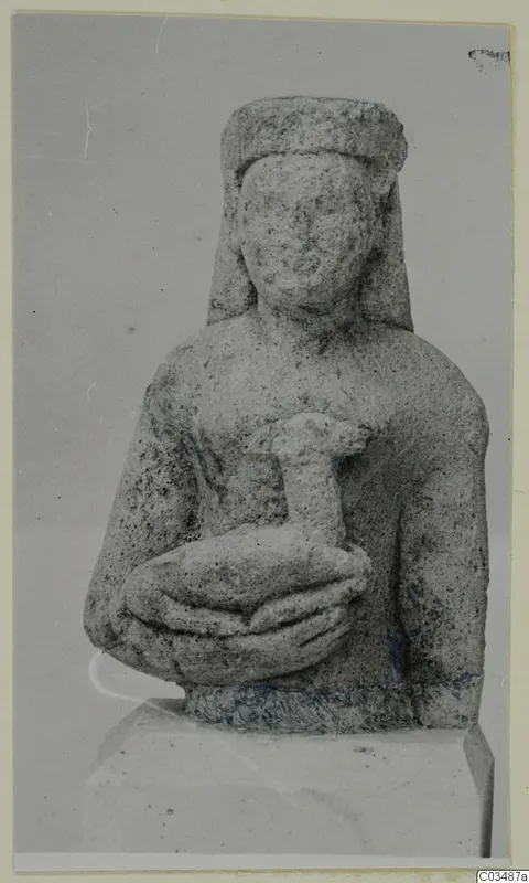 Limestone Neo-Cypriote bust of a woman holding a small figure against her chest