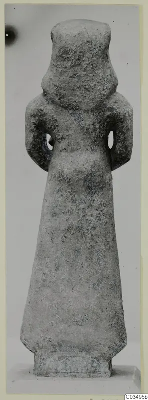 Limestone Neo-Cypriote figure, a standing statue seen from the front against a plain grey background.
