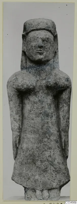 Limestone statue of a standing female figure with arms at her sides, seen from the front