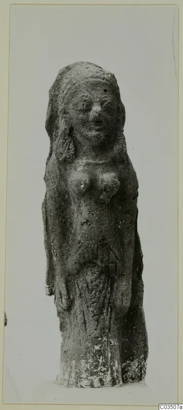 Terracotta figurine of a standing figure with a veiled head