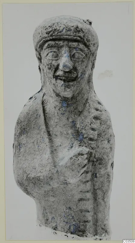 Terracotta figurine of a smiling figure in a cap, with traces of blue paint on the face and chest