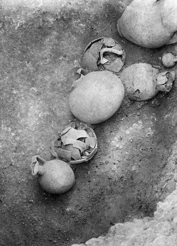 Vessels lying in situ on the floor of Tomb 19 at Stylli, seen from above