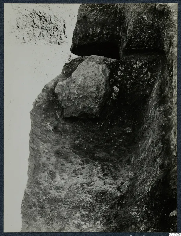 Excavation at Stylli with a large stone embedded in the side of the cutting