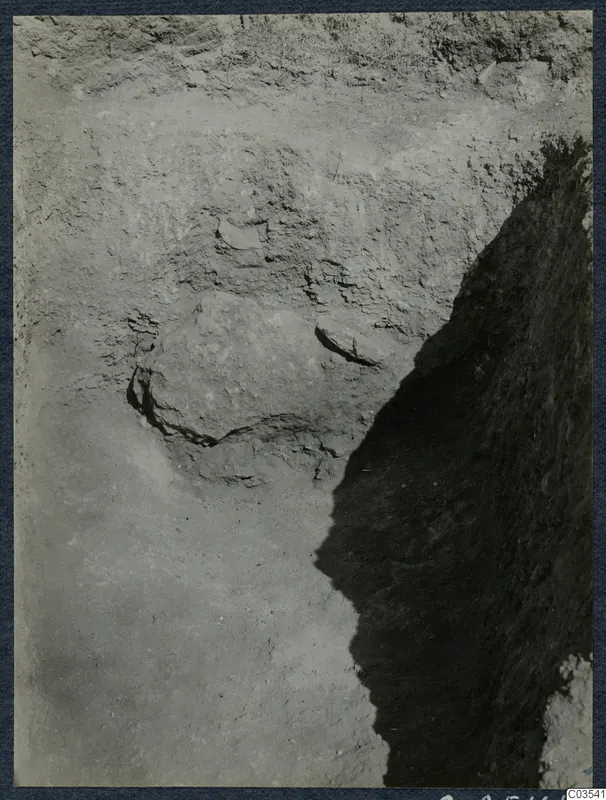 Excavation trench at Stylli with large stones embedded in the soil
