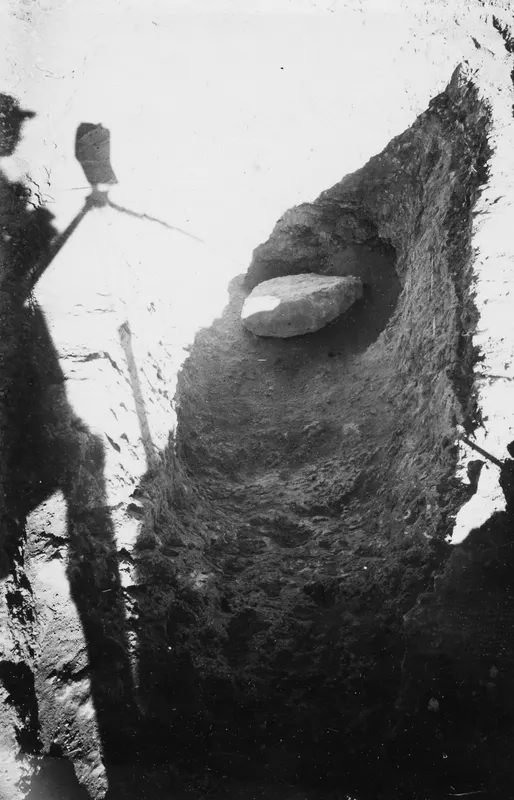 Tomb at Stylli with door packing: a large flat stone set into an excavated cut in the earth.