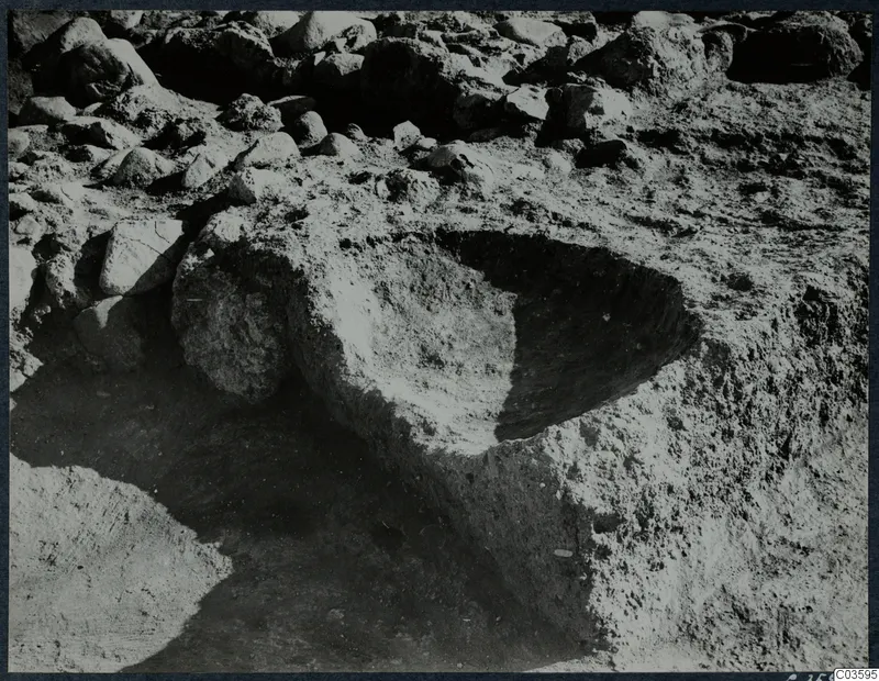 Rounded offering pit cut into excavated soil at Cholades, Room XLIII A, Soli, after excavation.