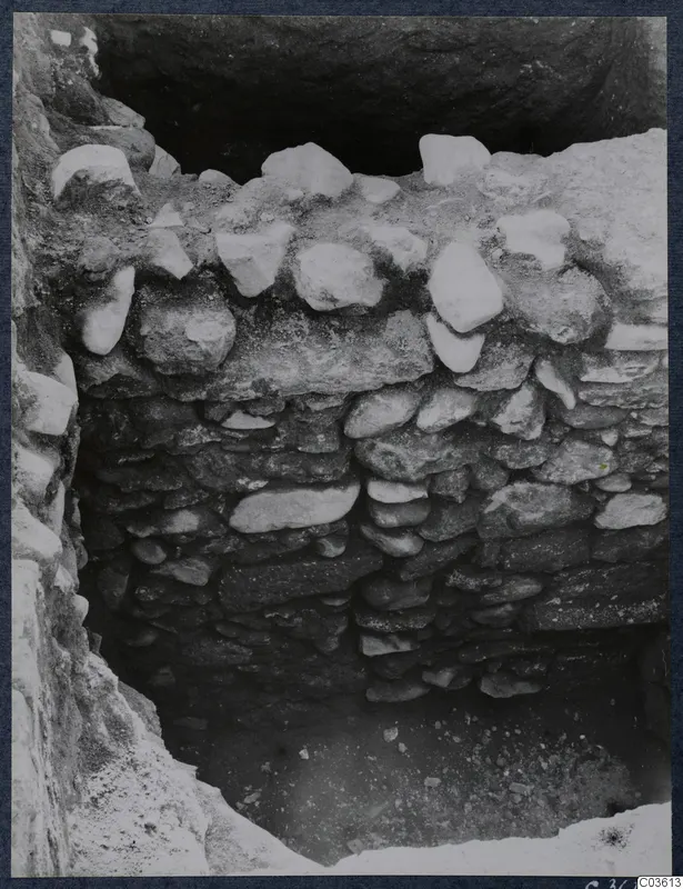Excavation at Soli showing a stone construction of rough stones, with an open cut below.