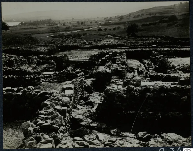 Excavated stone walls and foundations at Soli, Cholades temples, with fields and hills beyond