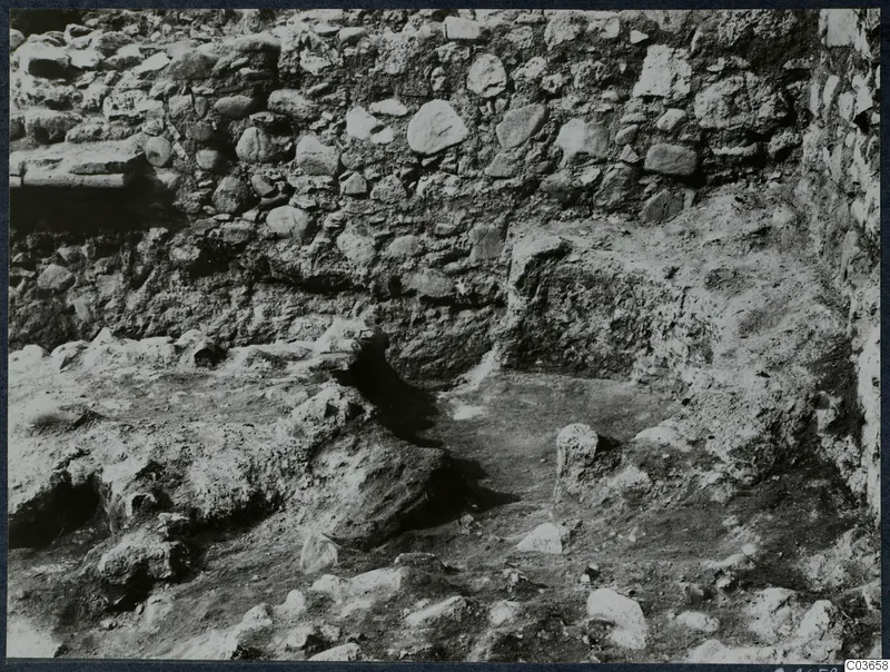 Excavated stone wall of rubble masonry at Soli, Cholades Temples C-F, with uneven earth ground in front
