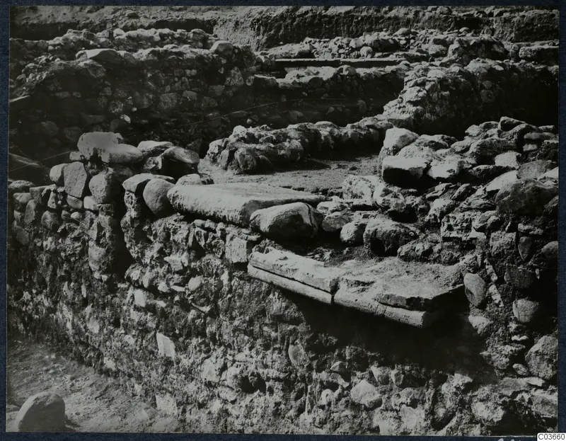Excavated stone walls and a flat stone slab at Soli, Cholades Temples C-F.