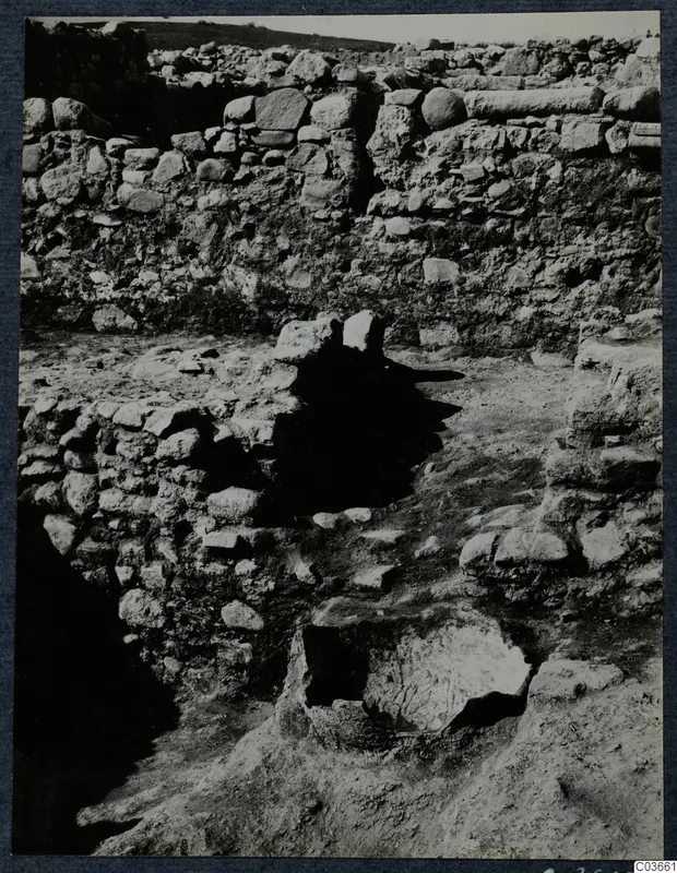 Excavated stone walls and a stone-lined pit at Soli, Cholades temples