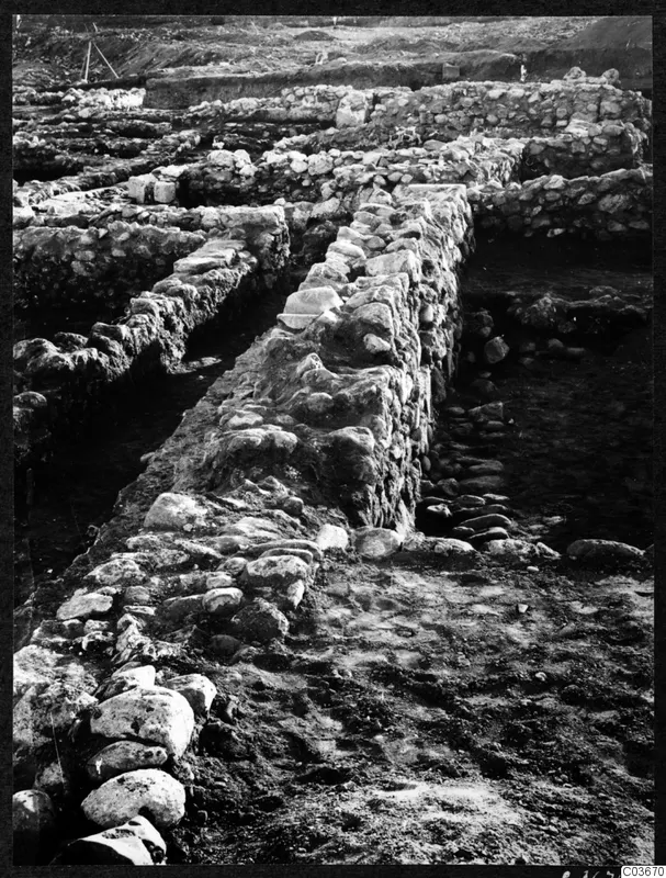 Excavated stone wall foundations at the Cholades Temples A-B at Soli, running across a large trench